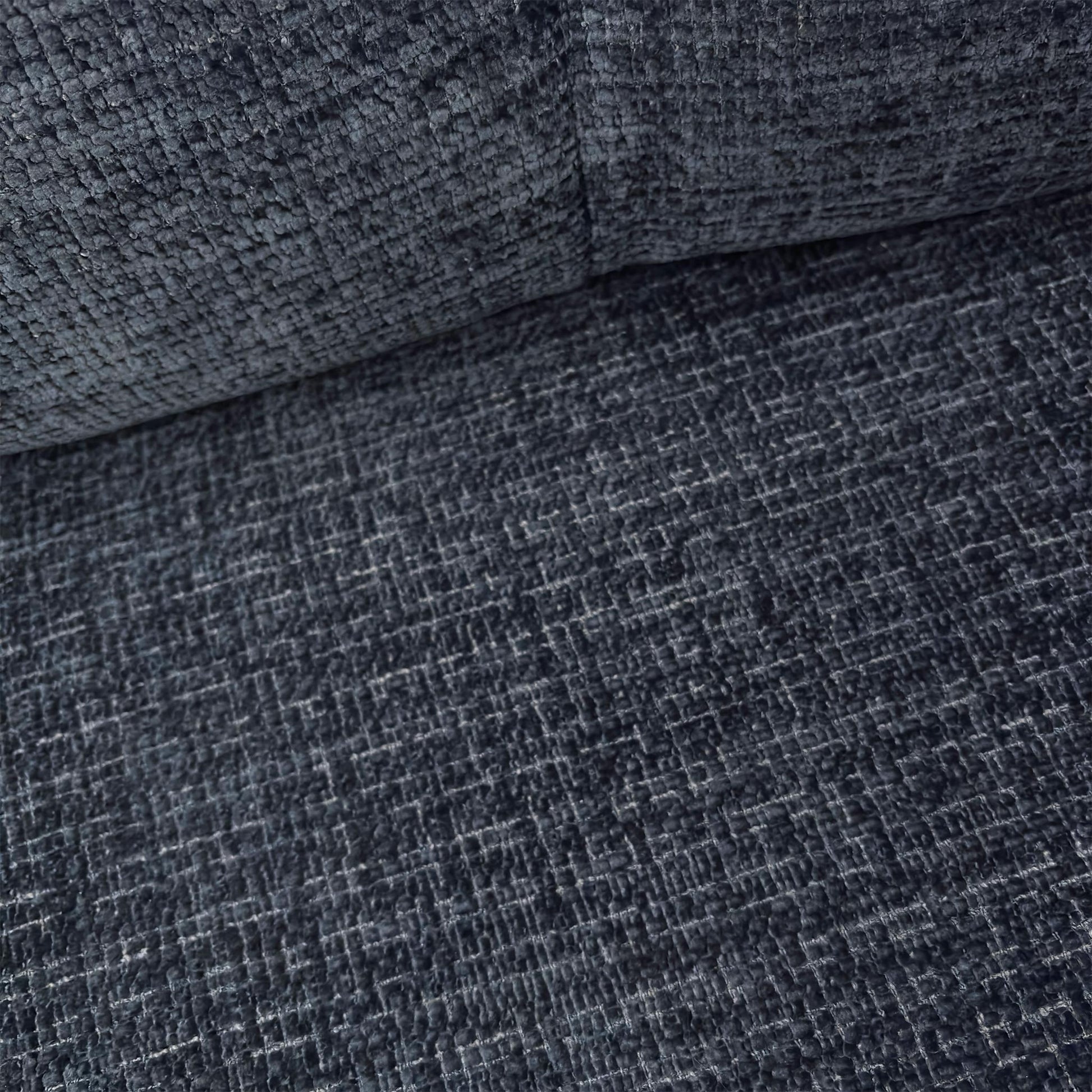 Close-up of the Allure snuggler chair, showcasing the detailed Indigo woven fabric and the generous seating area perfect for relaxation.