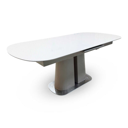Side profile view of the table, highlighting the slim, clean edges of the tabletop panel and the robust, structured design of the supporting base leg frame.