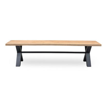 Front view of the Saturn dining bench, emphasizing the warm, natural grain of the organic oak top and the stable, angled profile of the black metal legs.