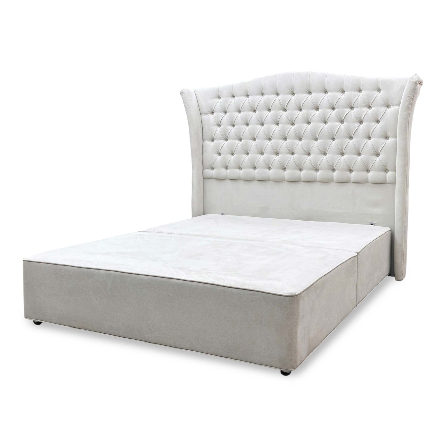 Side perspective of the Hypnos Hambleden bed layout, showcasing the flush floor-standing design of the headboard and the split architectural profile of the bespoke divan base sections.