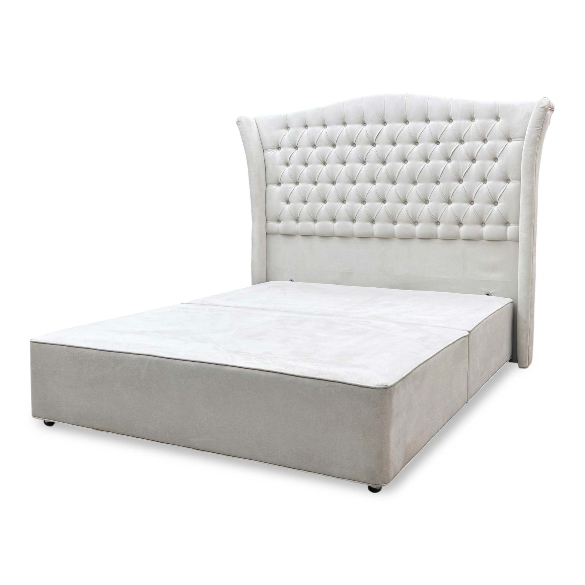 Side perspective of the Hypnos Hambleden bed layout, showcasing the flush floor-standing design of the headboard and the split architectural profile of the bespoke divan base sections.