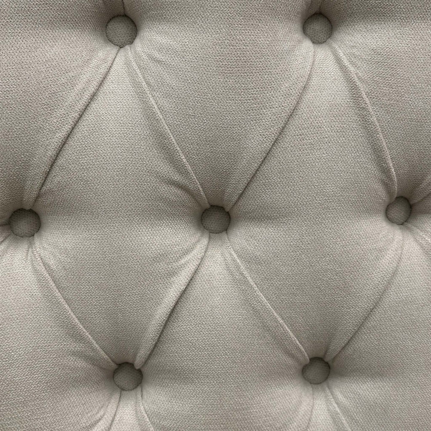 Close-up view of the smooth gliding corner castors or chrome glides mounted beneath the stone grey divan base sections for ease of movement.