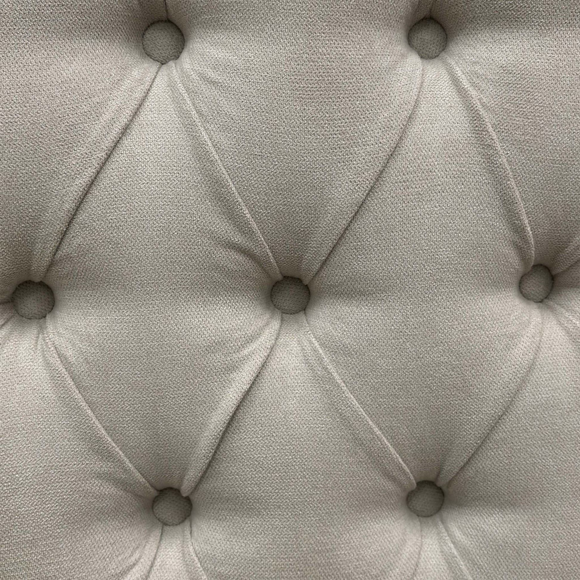 Close-up view of the smooth gliding corner castors or chrome glides mounted beneath the stone grey divan base sections for ease of movement.