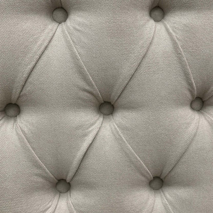 Close-up view of the smooth gliding corner castors or chrome glides mounted beneath the stone grey divan base sections for ease of movement.