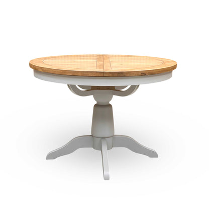 Front view of the butterfly extension mechanism as it smoothly unfolds from the center of the Joseph table to transform it into an oval shape.