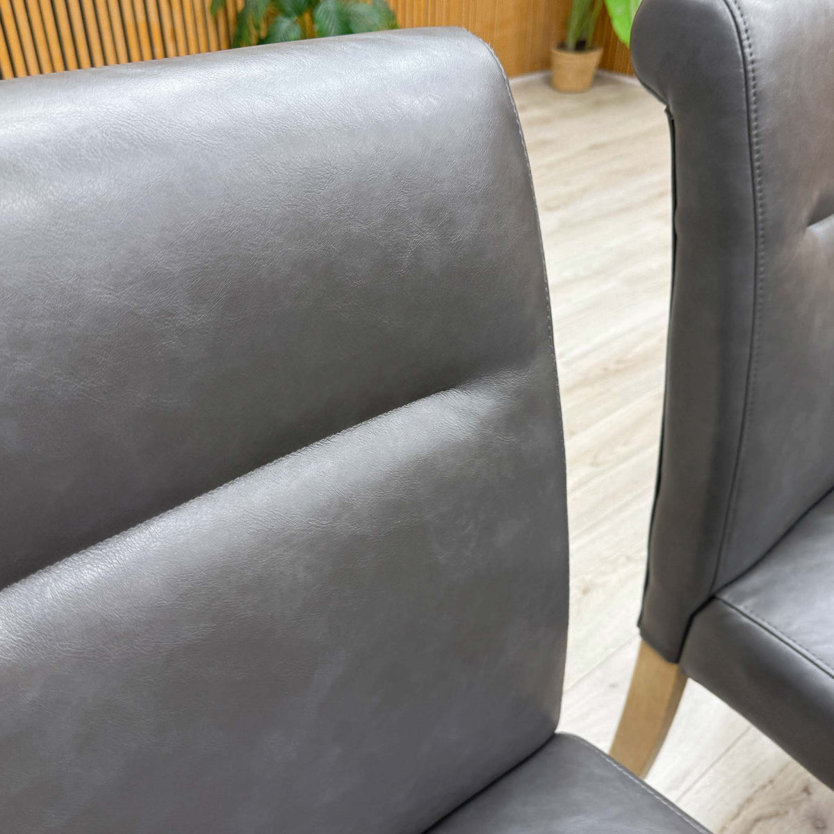 'Lewis' Solid Oak 120cm Large Draw Leaf Extending Dining Table with Dark Grey Faux Leather Roll Back Dining Chairs - Set of 6