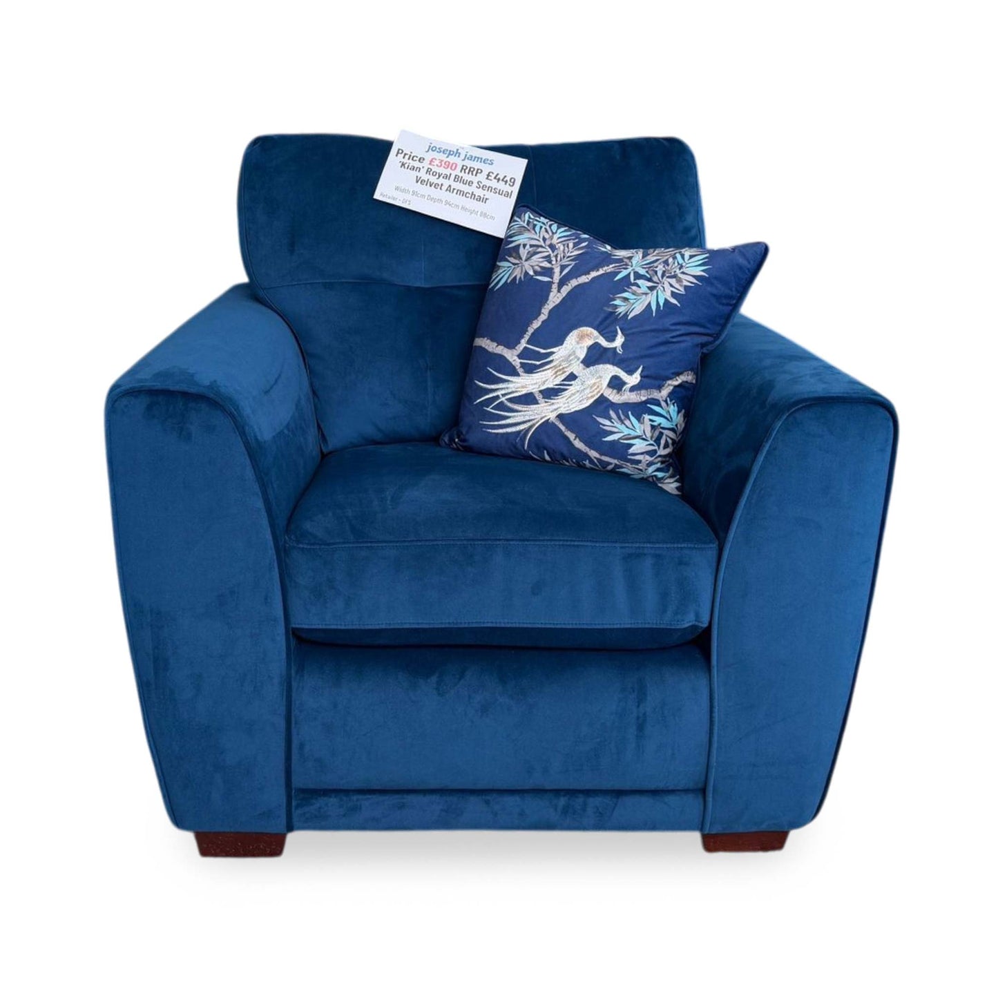 Front-facing view of the royal blue velvet armchair, highlighting its deep-cushioned seat, comfortable mid-height backrest, and clean geometric lines.