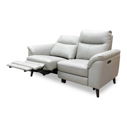 The sofa shown with both power footrests fully extended, demonstrating the smooth reclining functionality and comfort.