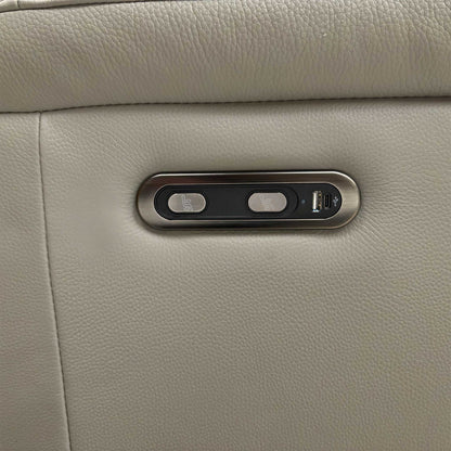 Detailed shot of the integrated power reclining controls and USB charging port located on the side of the armrest.