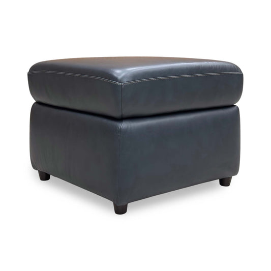 Full view of the Navy leather footstool, showcasing the uniform color and low-profile modern aesthetic.