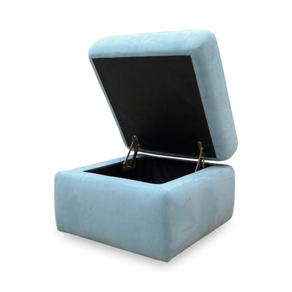 High-angle shot of the closed footstool, showing the generous surface area and the precision of the stitching.
