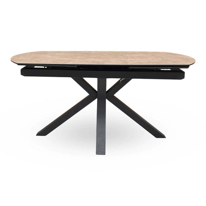 Front view of the Raul argile grey ceramic top 160cm dining table on its own with black metal star base