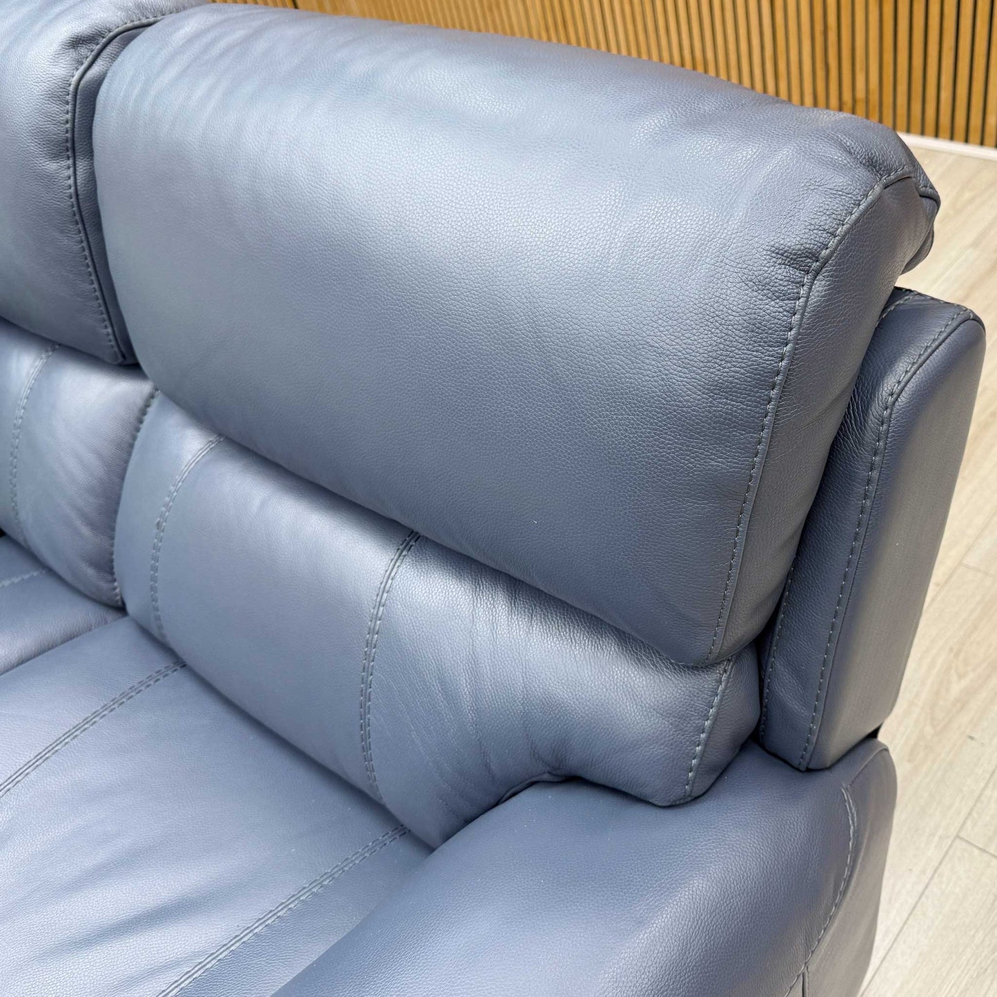 Close-up of the premium Ocean Blue leather, emphasizing the smooth texture and the rich, deep blue color saturation.
