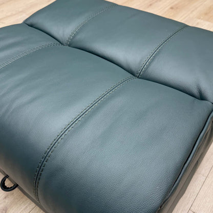 Close-up of the Lake Green leather, highlighting the premium grain texture and unique deep teal-green color tone.