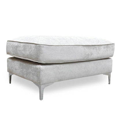 Full view of a rectangular Legend 'Kingston' footstool upholstered in silver fabric, featuring a deeply buttoned tufted top and dark wooden legs.