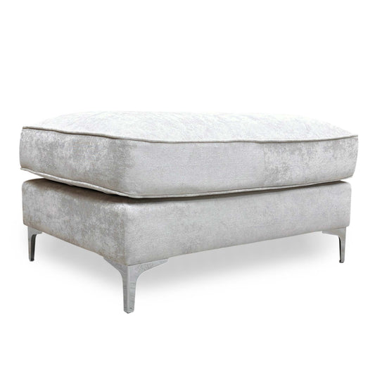 Full view of a rectangular Legend 'Kingston' footstool upholstered in silver fabric, featuring a deeply buttoned tufted top and dark wooden legs.