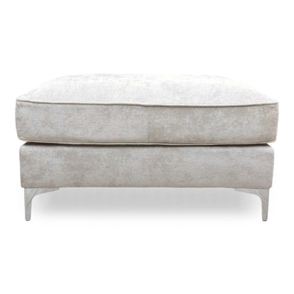 Front view of the silver fabric footstool, showcasing the classic Chesterfield-style tufting and structured rectangular shape.