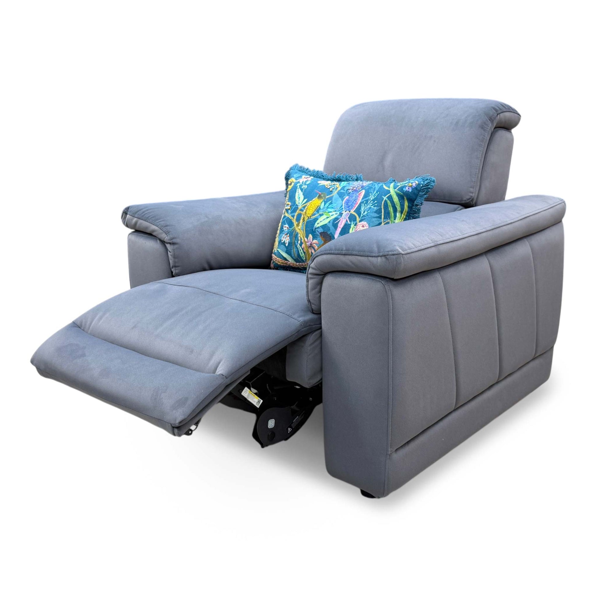 The chair shown in a fully reclined position with the power footrest extended and the power headrest tilted forward.