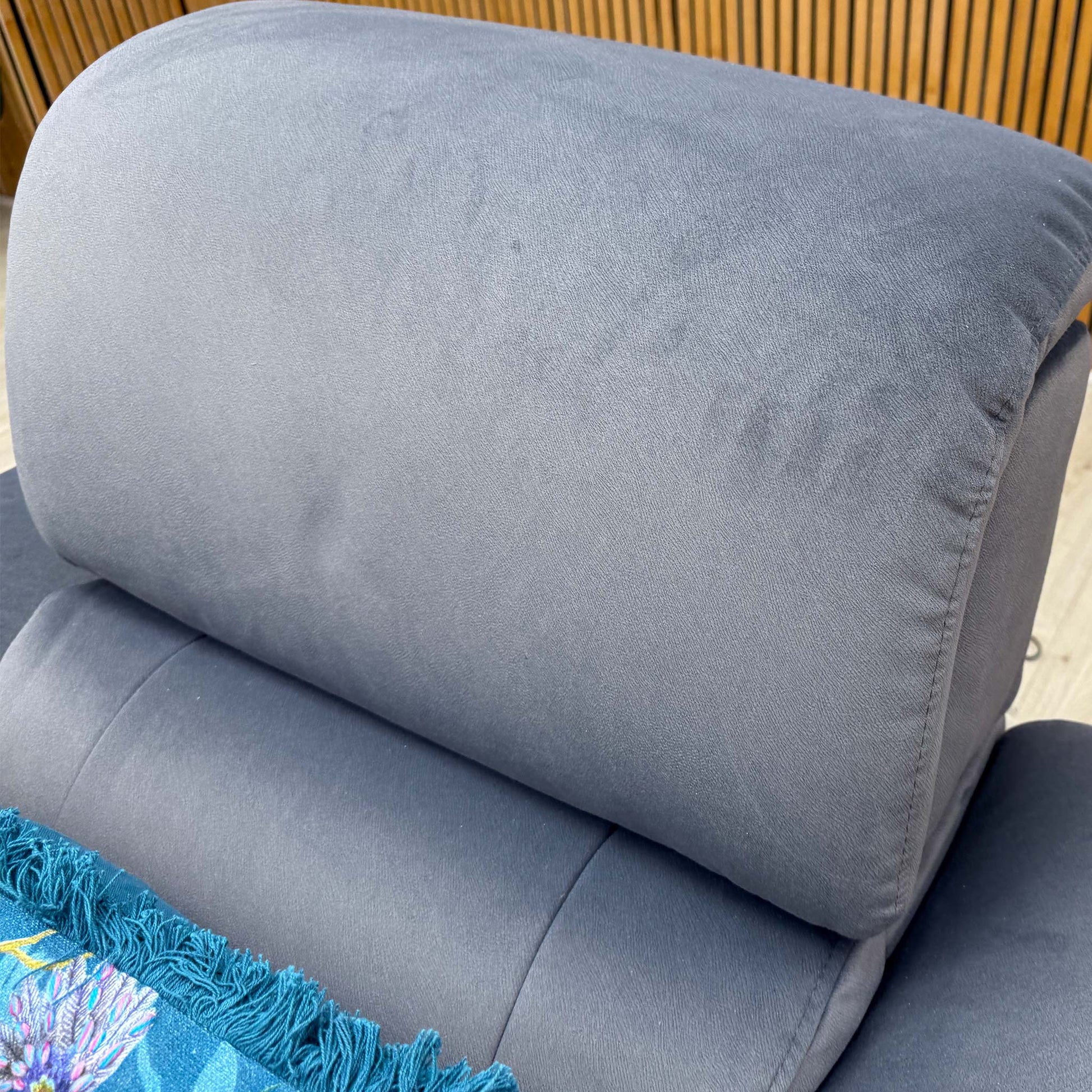 High-angle shot looking down at the seat and lumbar support, highlighting the ergonomic stitching and generous padding.