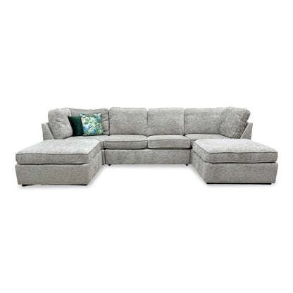 Front view of the central seating section, demonstrating the generous depth and the uniform alignment of the plush cushions.