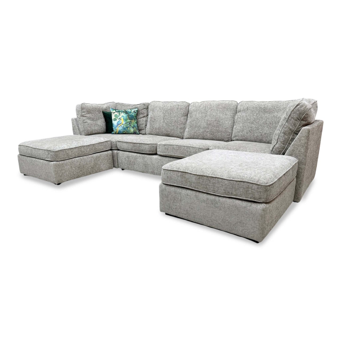 of the right side of the U-shaped sofa, showcasing the clean lines of the back cushions and the spacious chaise lounge.