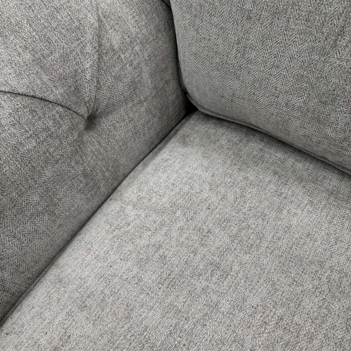 Close-up of the Darwin Silver fabric upholstery, demonstrating the high-quality weave and neutral silver tone.