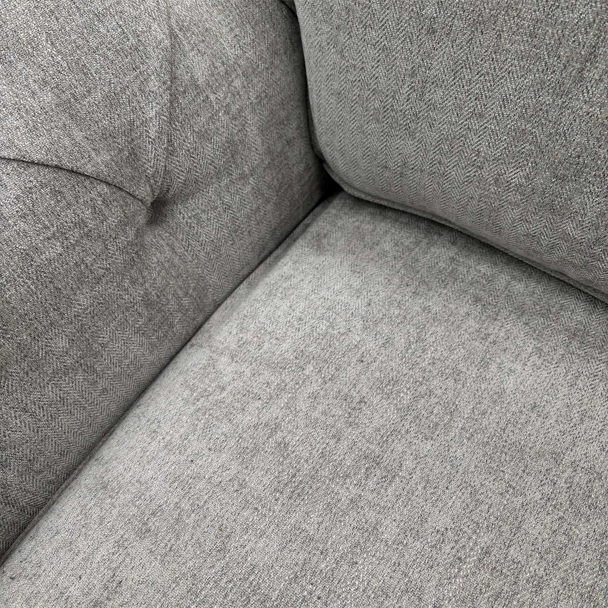 Close-up of the Darwin Silver fabric upholstery, demonstrating the high-quality weave and neutral silver tone.