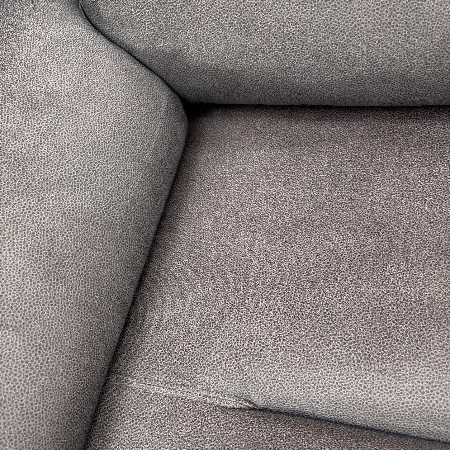 Detail shot of the Stingray Charcoal velvet fabric texture, illustrating the premium finish and luxurious feel of the material.