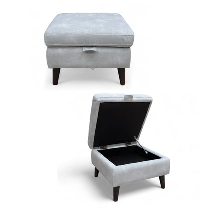 Full view of the Furniture Village 'Morgan' storage footstool in Smoke Sky Blue velvet with modern metallic tapered legs.