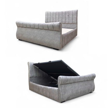 Gray upholstered bed with storage compartment on a white background
