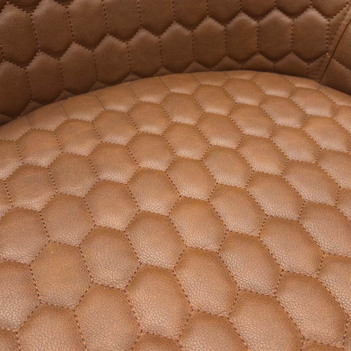 Close-up of the tan brown faux leather material, emphasizing the realistic grain texture and contrast stitching.