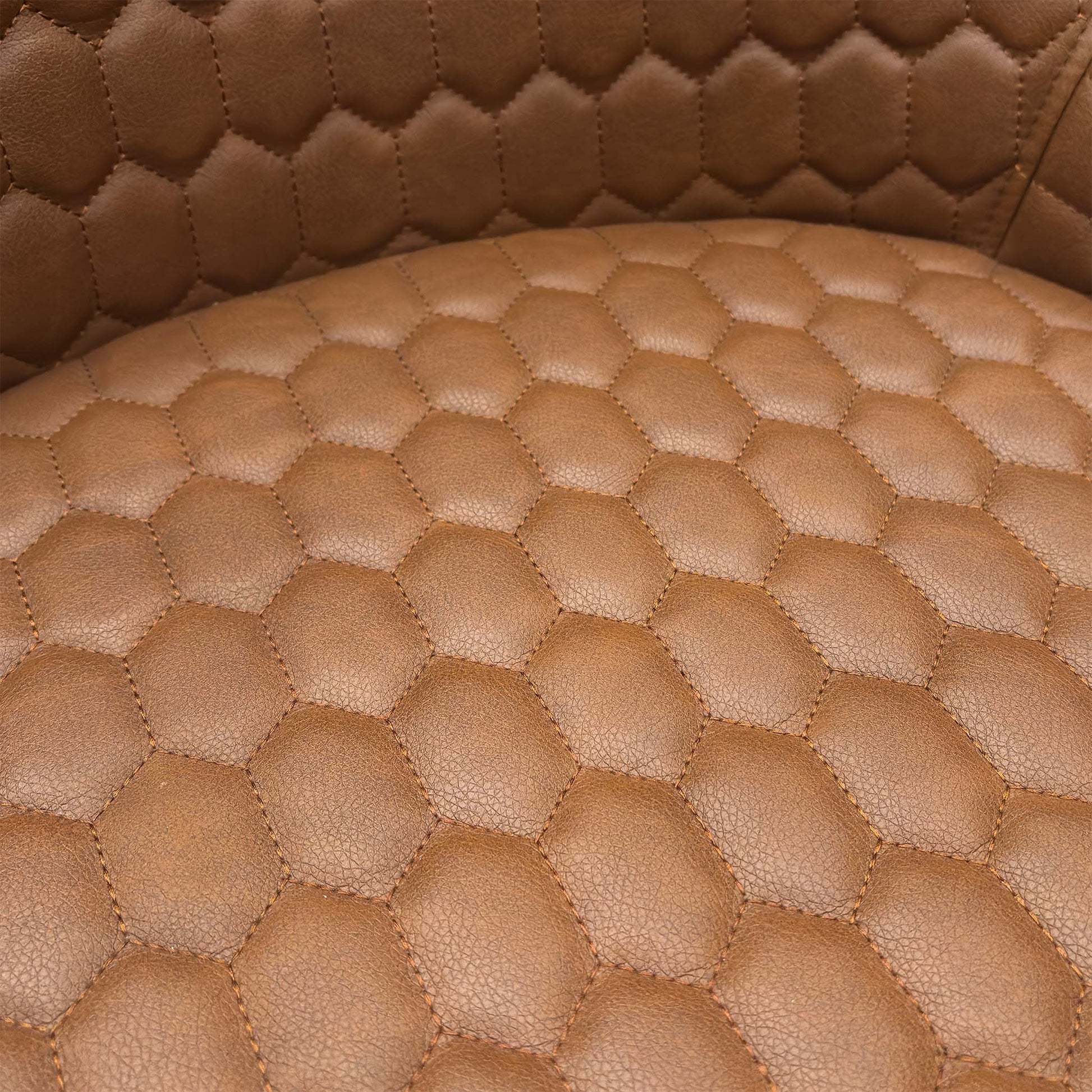 Close-up of the tan brown faux leather material, emphasizing the realistic grain texture and contrast stitching.