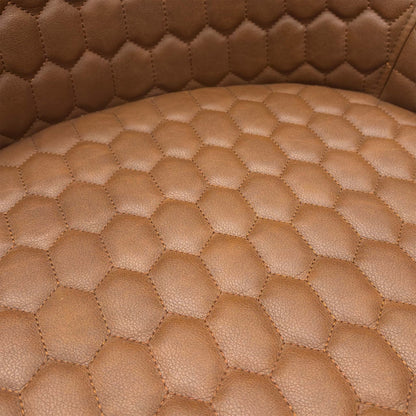 Close-up of the tan brown faux leather material, emphasizing the realistic grain texture and contrast stitching.