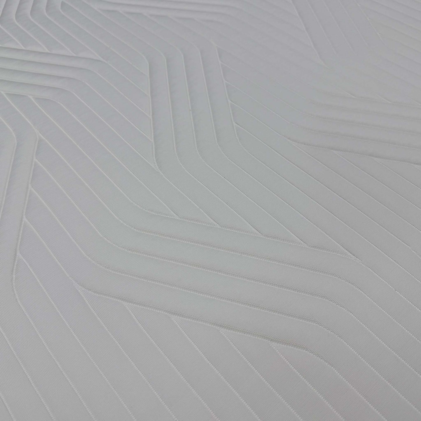 High-definition close-up macro view of the specialized QuickRefresh cover fabric, detailing the advanced knitted textile patterns, breathable weave, and zipper line.