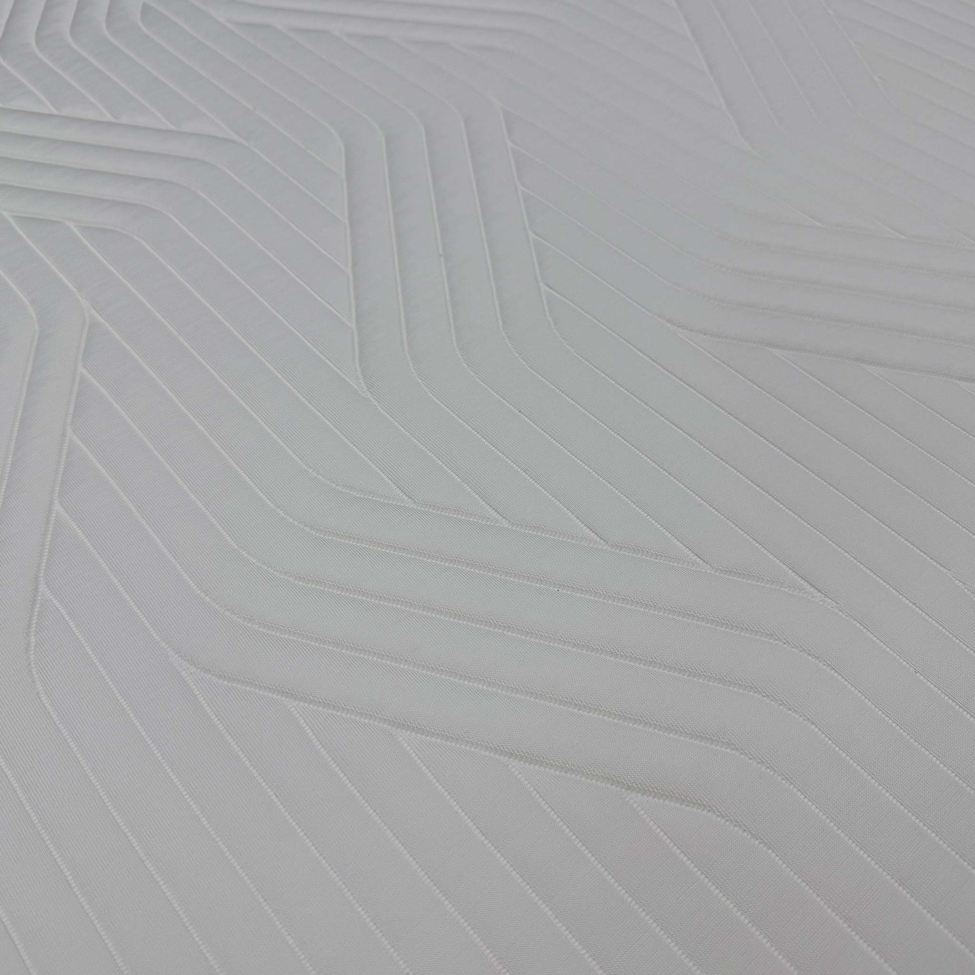 High-definition close-up macro view of the specialized QuickRefresh cover fabric, detailing the advanced knitted textile patterns, breathable weave, and zipper line.