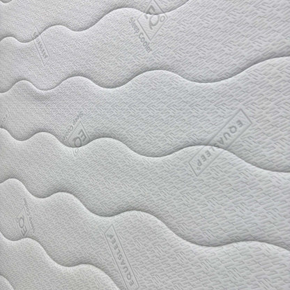 Close-up of the memory foam comfort layer, emphasizing how the material contours to the body for tailored pressure relief and spinal alignment.