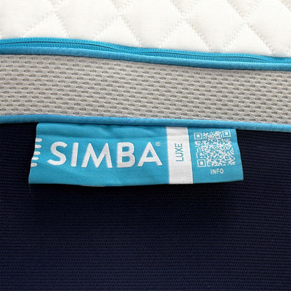 Close up shot of the mattress corner with the blue Simba branding and the heavy-duty handles designed for easier maneuvering of the king size model.