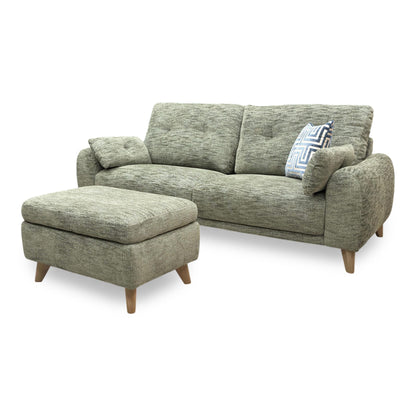 View of the sofa base and legs, highlighting minor scuffs and surface scratches on the black support feet.