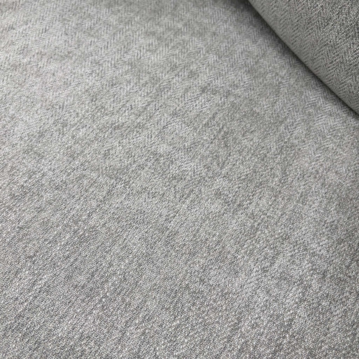 Close-up of the Darwin Silver fabric upholstery and scatter back cushions, showcasing the soft texture and neutral tone.