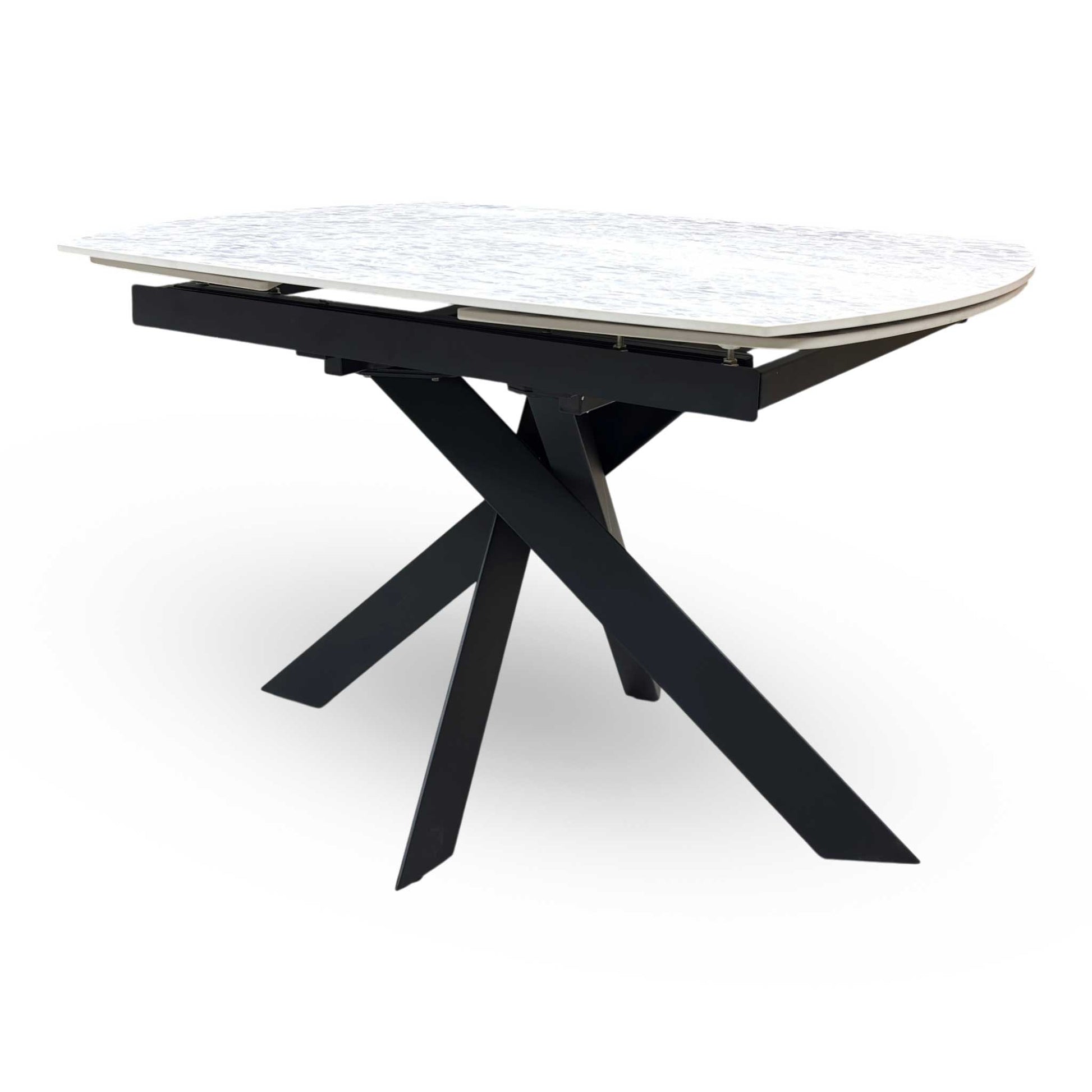 Side view of the Warrior table fully extended to 180cm, demonstrating the generous oval surface area that comfortably seats 6 to 8 people for dinner parties.