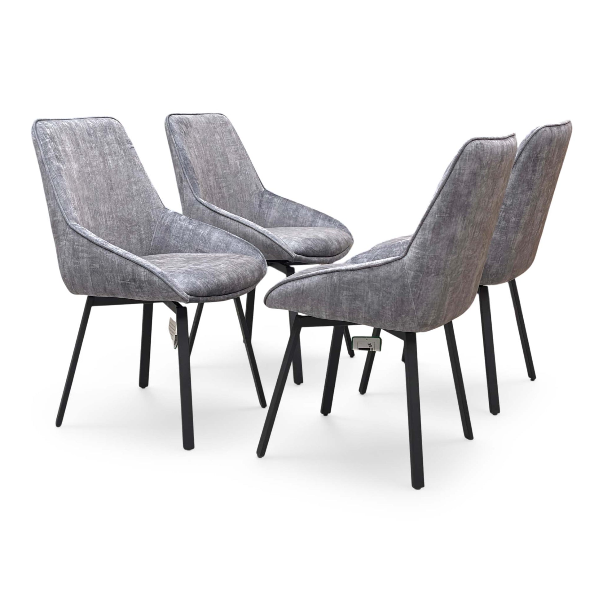 Side view of a grey velvet Veja chair, showcasing the quilted diamond stitching on the backrest and the contoured ergonomic shape.