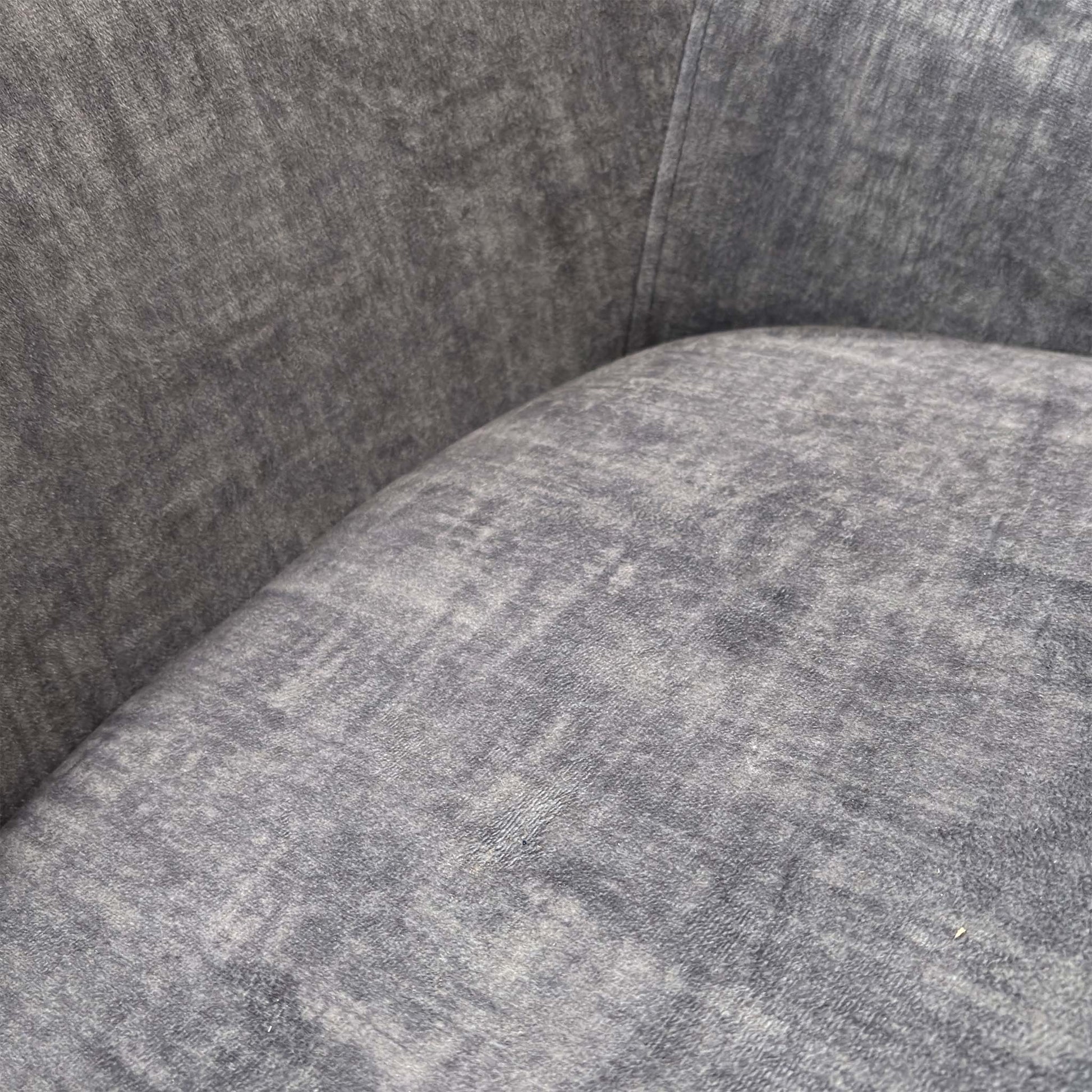 Close-up view of the Veja chair, demonstrating the clean lines and high-quality upholstery work on the outer shell.
