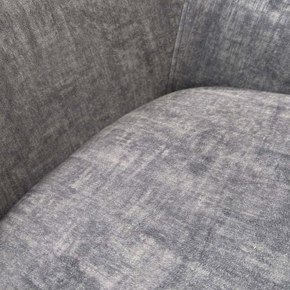 Close-up view of the Veja chair, demonstrating the clean lines and high-quality upholstery work on the outer shell.