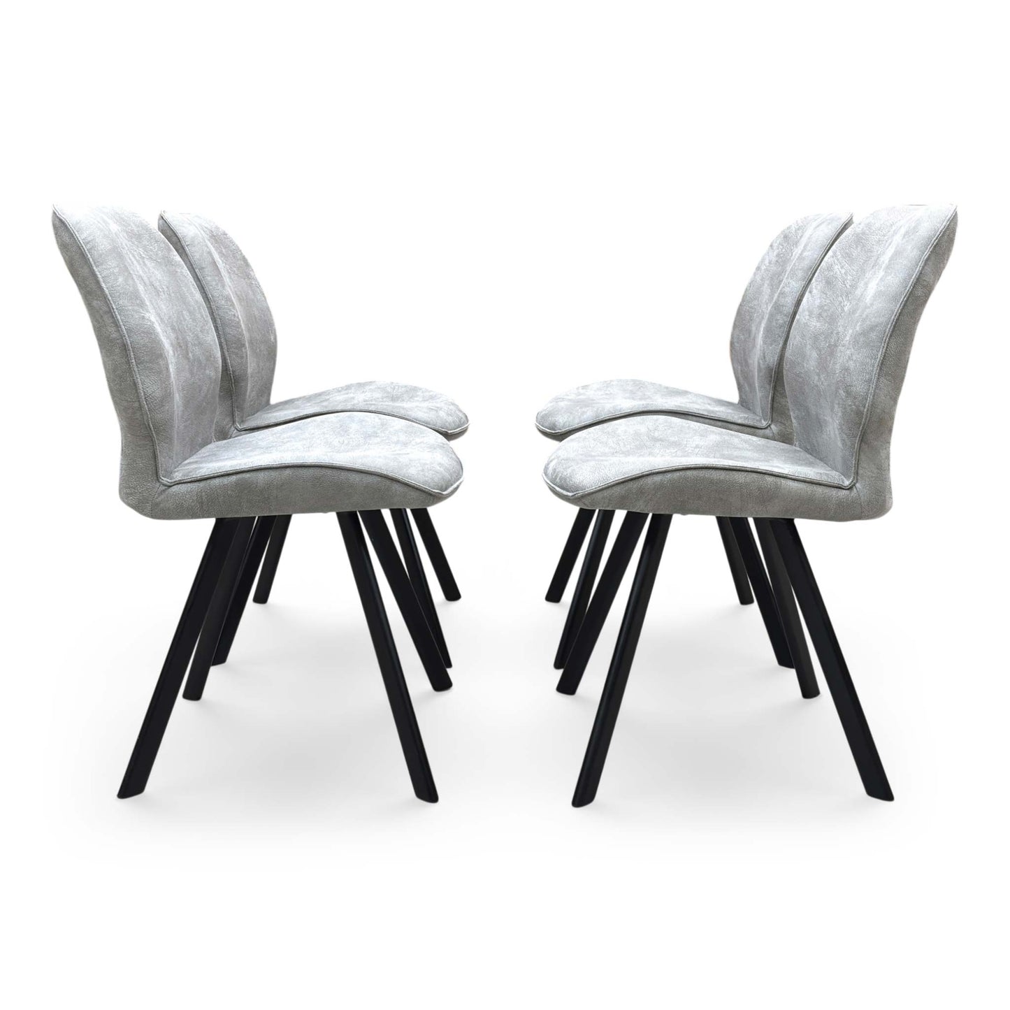 Front-facing view of a Montreal grey velvet dining chair, highlighting the plush padded seating surface and elegant transitional backrest design.