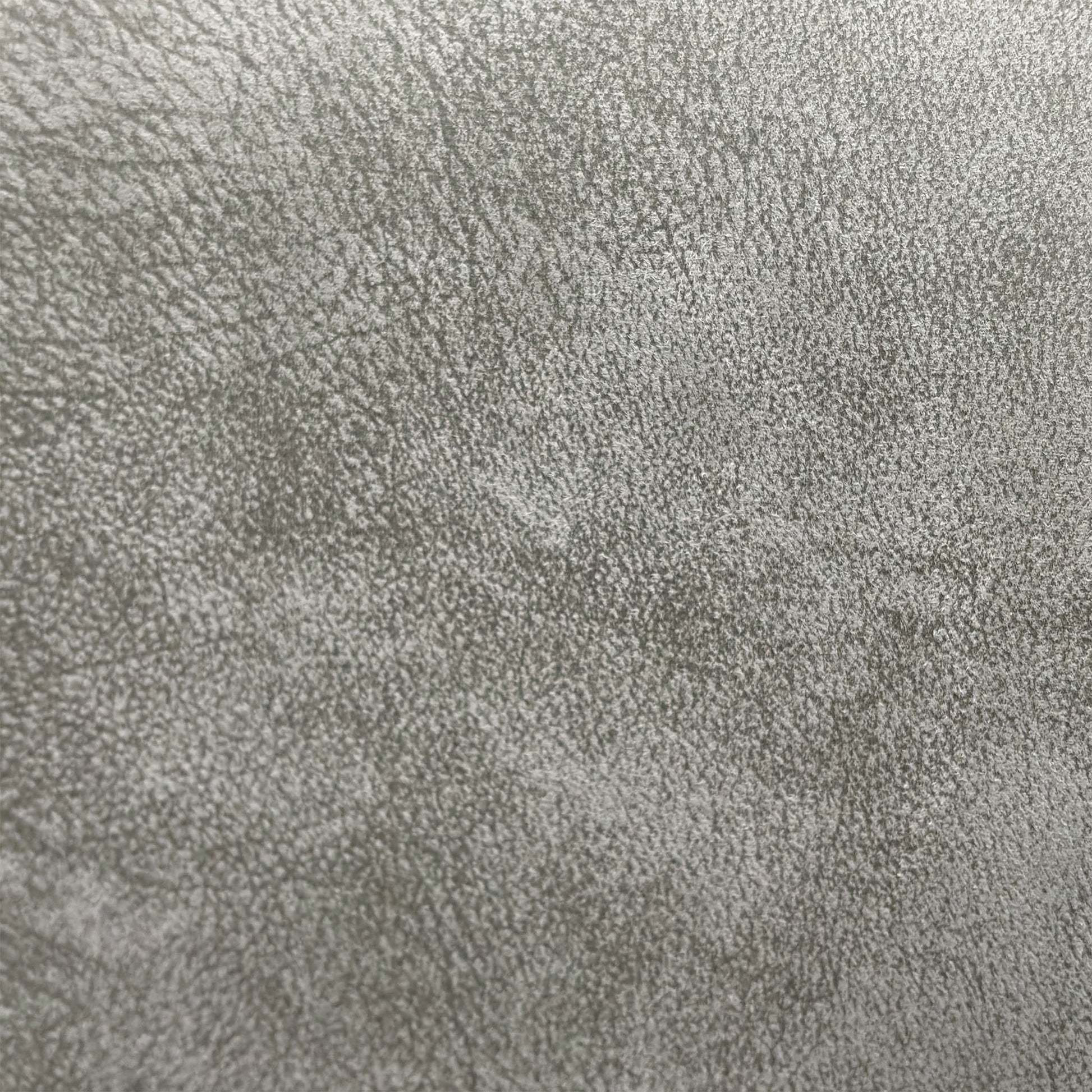 Close-up shot of the soft grey velvet upholstery fabric, detailing the fine luxurious texture, sheen, and durable premium weave finish.