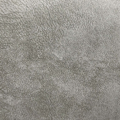 Close-up shot of the soft grey velvet upholstery fabric, detailing the fine luxurious texture, sheen, and durable premium weave finish.