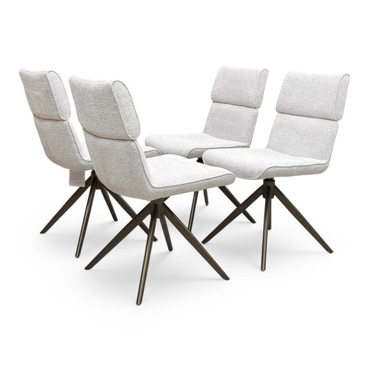 Full view of four modern 'Mekong' dining chairs featuring pale grey fabric upholstery and elegant bronze-coloured swivel bases.
