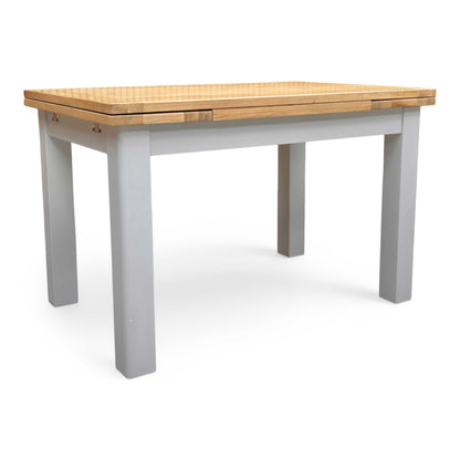 Side view of the Lewis table in its fully extended position, illustrating how the two end leaves pull out to increase the seating capacity for guests.