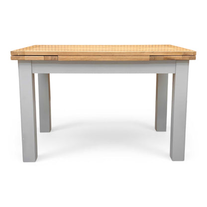 Front shot of the solid oak tabletop, emphasizing the natural knots, unique grain variations, and the durable protective lacquer finish.