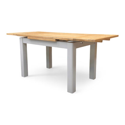 Side profile of the dining table, showcasing the clean, straight lines and the space-saving functionality of the draw-leaf system.